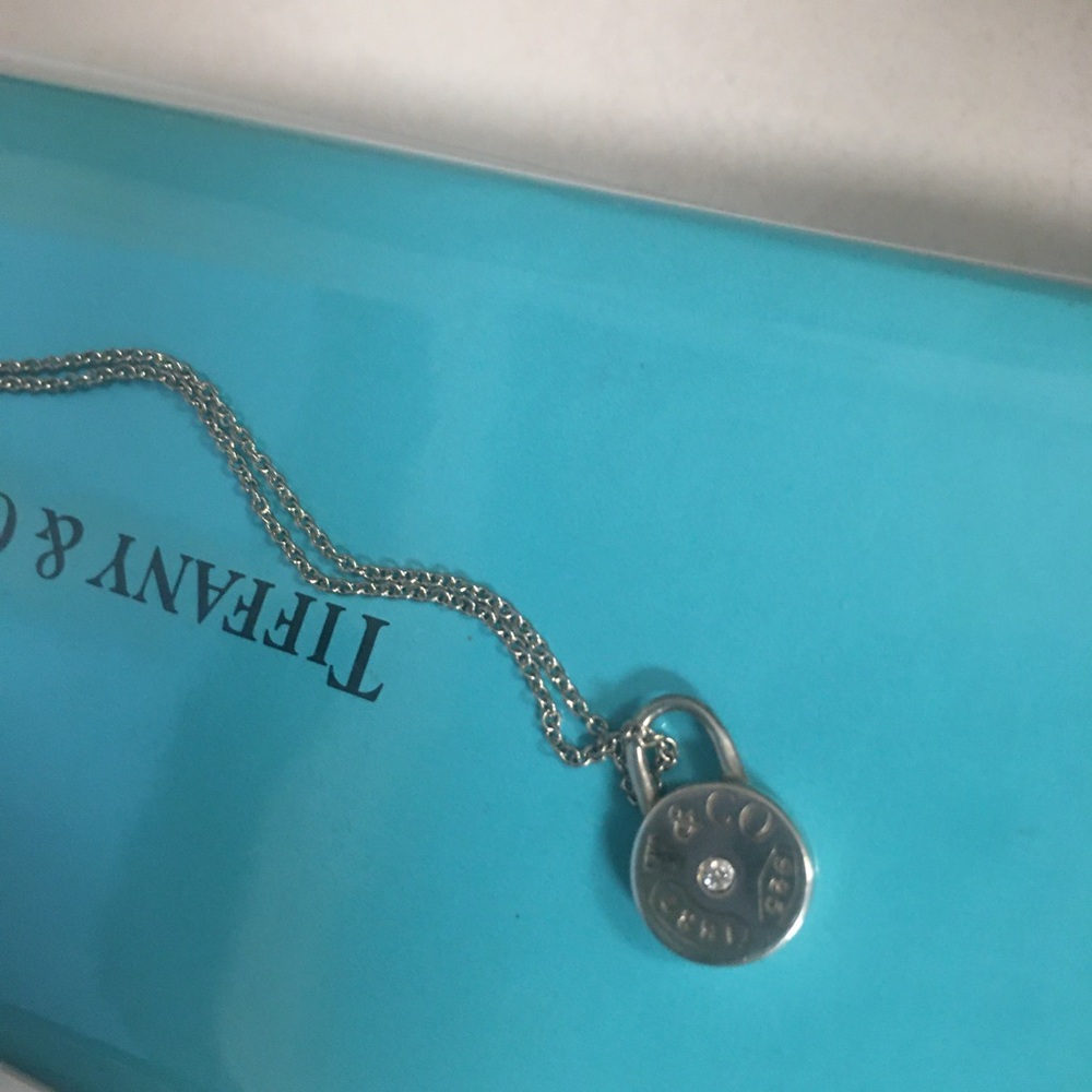 Tiffany&Co sterling with a Diamond mini charm with  original  chain unisex.
